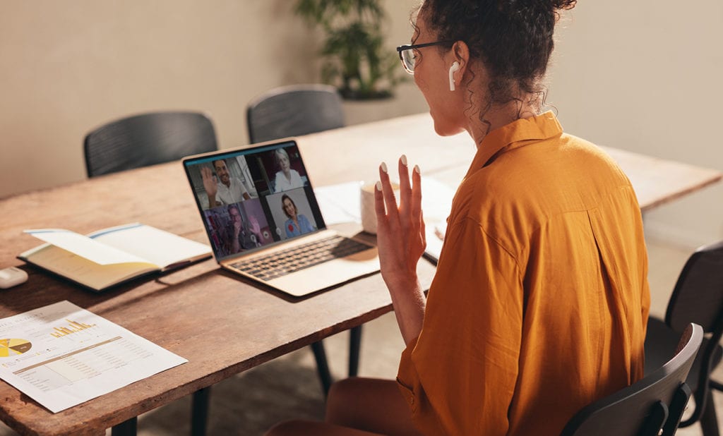 A new wellness coach meets with her client on a video call after leaving her job due to job burnout to start a new career as a wellness coach.